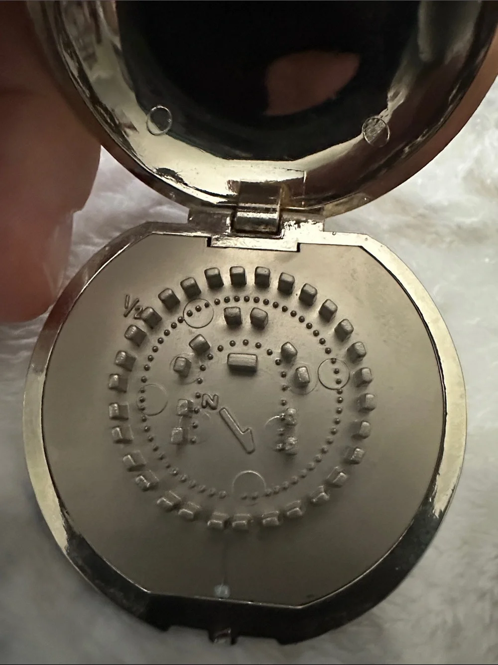 Silver toned Metallic pocket Stonehenge sun dial.